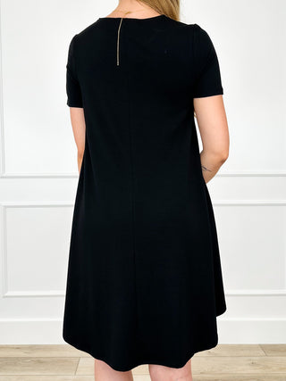 Lightweight black short-sleeve back view dress with small back neckline opening