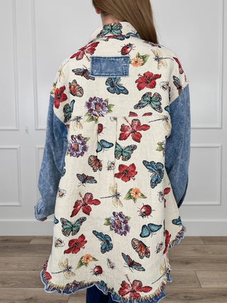 Cream long-sleeve knit jacket with multicolor butterfly and floral back print, denim sleeves
