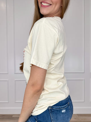Cream cotton short-sleeve tee, side view with partial "Leave Football" graphic