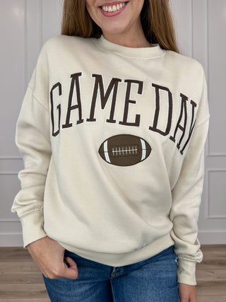 Cream crewneck long-sleeve sweatshirt with GAME DAY lettering and football graphic
