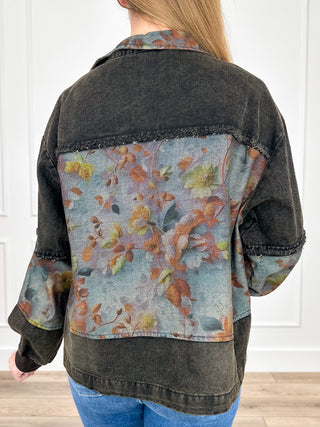Back view black cropped denim jacket with large floral contrast yoke and zip front