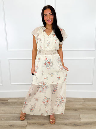 Floral maxi dress with short puff sleeves, V-neck, and tiered skirt