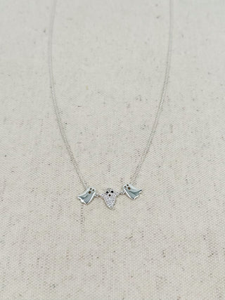 Silver charm necklace with two bat pendants and small star details