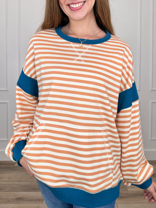 Striped knit long-sleeve top in orange and white with teal contrast trim