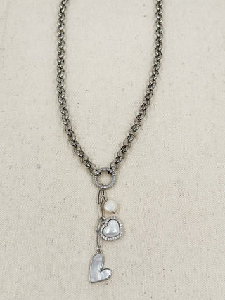 Silver chain necklace with circular peace charm, faux pearl, and heart pendant