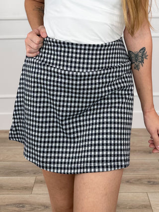 High-rise knit skort, black gingham pattern, elastic waistband, A-line hem