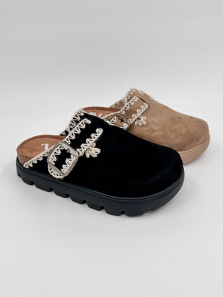 Black faux suede clogs with embroidered strap detail and contoured platform sole
