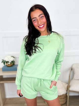 Green high-rise shorts set with long-sleeve crewneck sweatshirt and elastic-waist shorts