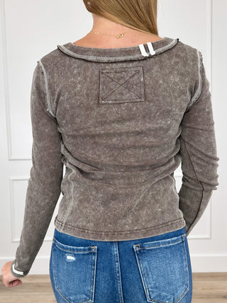 Brown long-sleeve henley top with square back yoke and relaxed fit