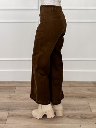 Brown high-rise wide-leg denim jeans, back view with yoke and belt loops