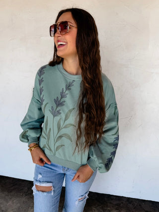 Green cotton-blend long sleeve pullover top with leaf print