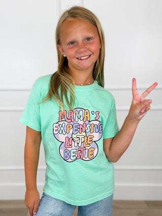 Kids cotton short-sleeve graphic tee in mint green, worn by child, 'Mama's Expensive Little Bestie'