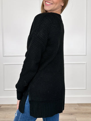 Black knit long-sleeve cardigan with open front and textured waffle knit body
