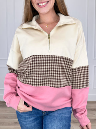 Long-sleeve quarter-zip top in cream with black/white gingham and pink color-block hem