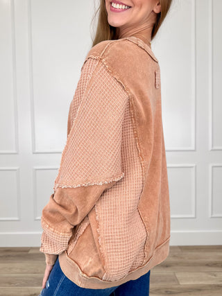 Clay cotton long-sleeve crewneck top, side view with cuffed mesh-textured sleeves