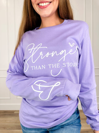 Purple long-sleeve graphic cotton tee with 'Stronger' and heart accents