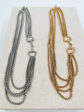 Layered metal chain necklace set, silver and gold tones, with clasp and O-ring details