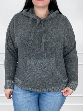 Grey knit hooded sweater with long sleeves; front view with drawstring hood and ribbed hem.