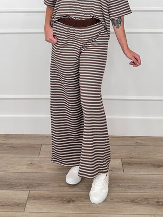 Brown striped high-rise flare pants with drawstring waist and side pockets