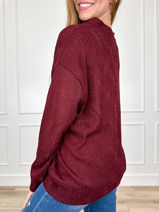 Wine red knit long-sleeve button-up cardigan with V-neck and small button closure
