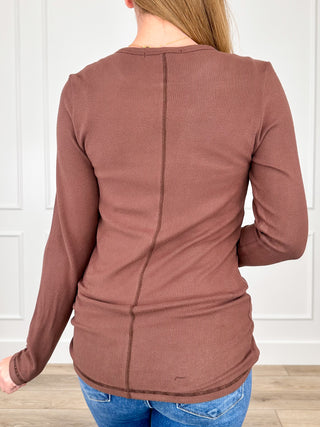 Brown long-sleeve henley top, back view, with vertical seam and button placket
