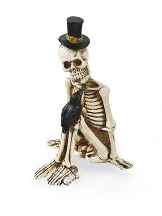 Skeleton resin decor figure in black top hat and dark cloth, posed seated