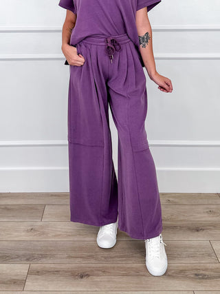 Smoky lilac wide-leg pants with drawstring waist and front patch pockets