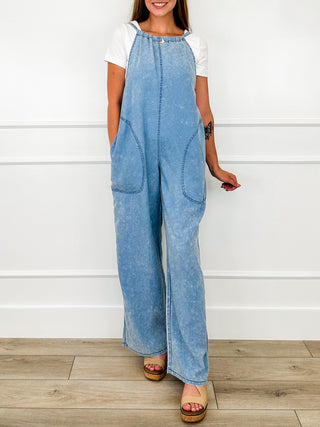 Cotton-blend Avery Mae jumpsuit, blue with tie-neck and patch pockets, wide-leg