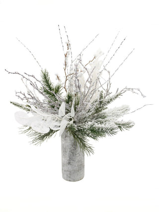 Snowy pine and frosted branches decor in gray pot with white ornaments