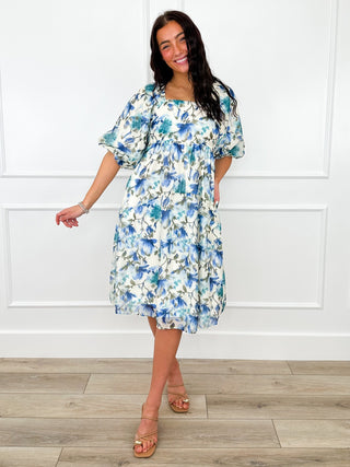 Floral tiered dress with ruffled sleeves and elastic waist, knee length