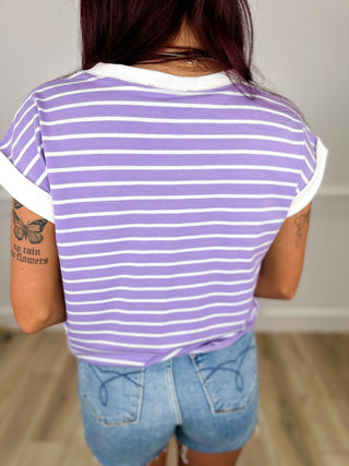 Purple-and-white striped cotton blend short sleeve top, back view.