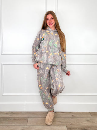 Women's camo print joggers with elastic drawstring waist and ankle cuffs