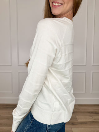 Ivory knit long-sleeve sweater, curved hem and ribbed cuffs