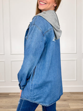 Medium-wash denim hoodie jacket with gray hood lining and distressed sleeve seams