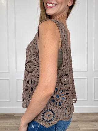 Brown crochet tank top side view with openwork lace pattern and floral roundels