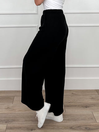 Tell Me This high-rise knit wide-leg pants in black, elastic waist, side view