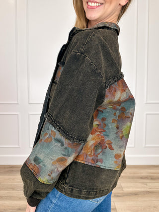 Black cropped denim jacket with floral contrast sleeve panel and zip front, side pockets