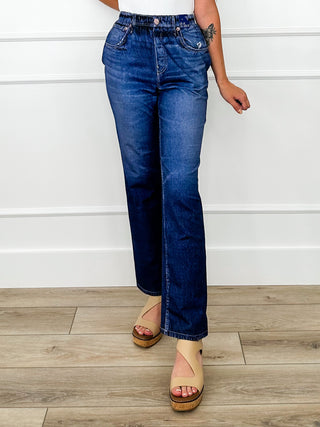 High-rise dark wash denim jeans, button fly, belt loops, wide straight legs