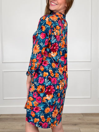 Floral teal Gabby dress with V-neck and long sleeves, side view