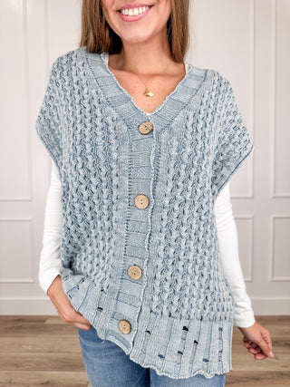 Light blue cotton knit sweater vest with V-neck and button front