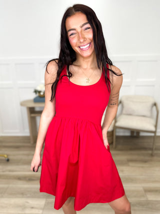 Red cotton blend sleeveless dress with square neckline and gathered skirt