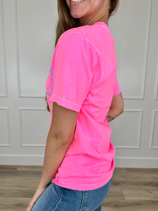 Pink cotton short-sleeve graphic tee with smiling face design, side view