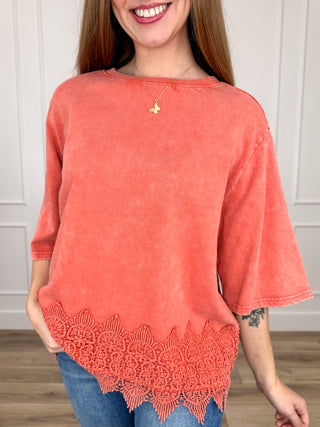 Orange cotton short-sleeve top with scalloped lace hem