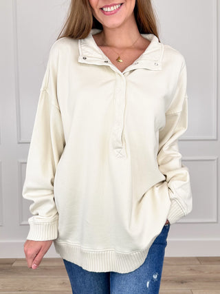 Cream cotton long-sleeve pullover sweatshirt with hood, button placket, ribbed cuffs