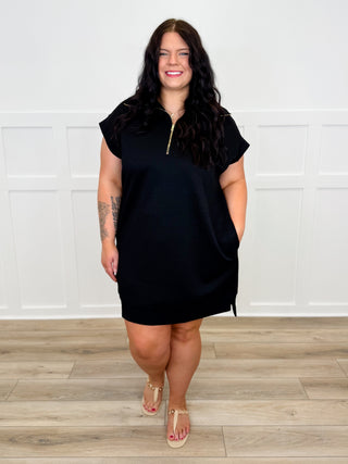Black knit shift dress with short sleeves and half-zip front