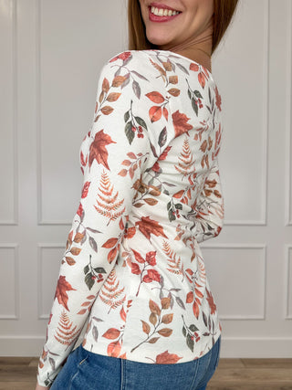 Long-sleeve knit top with autumn leaf print, round neckline; side view