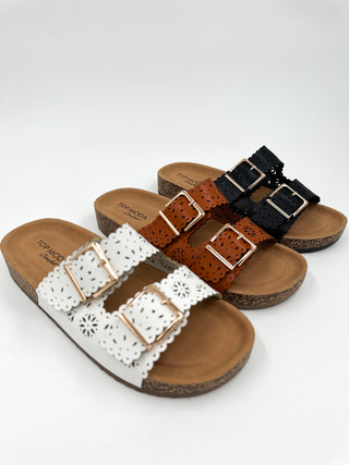 Faux leather sandals with cutout straps and two metal buckles, white
