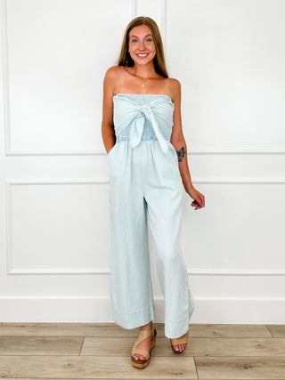 Blue cropped strapless jumpsuit with bow at neckline, smocked bust, wide legs