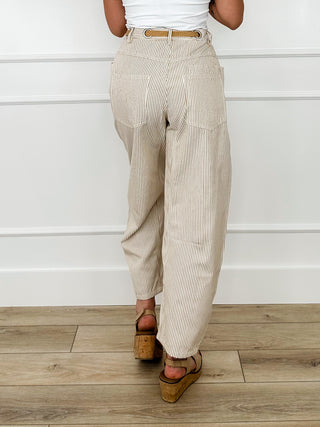 High-rise cream striped pants with drawstring waist and ankle cuffed legs