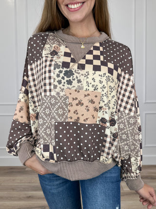 Brown patchwork long-sleeve top with floral and check pattern, crew neck